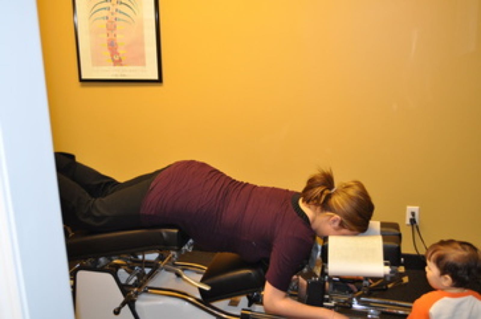Pregnant patient on a chiropractic table