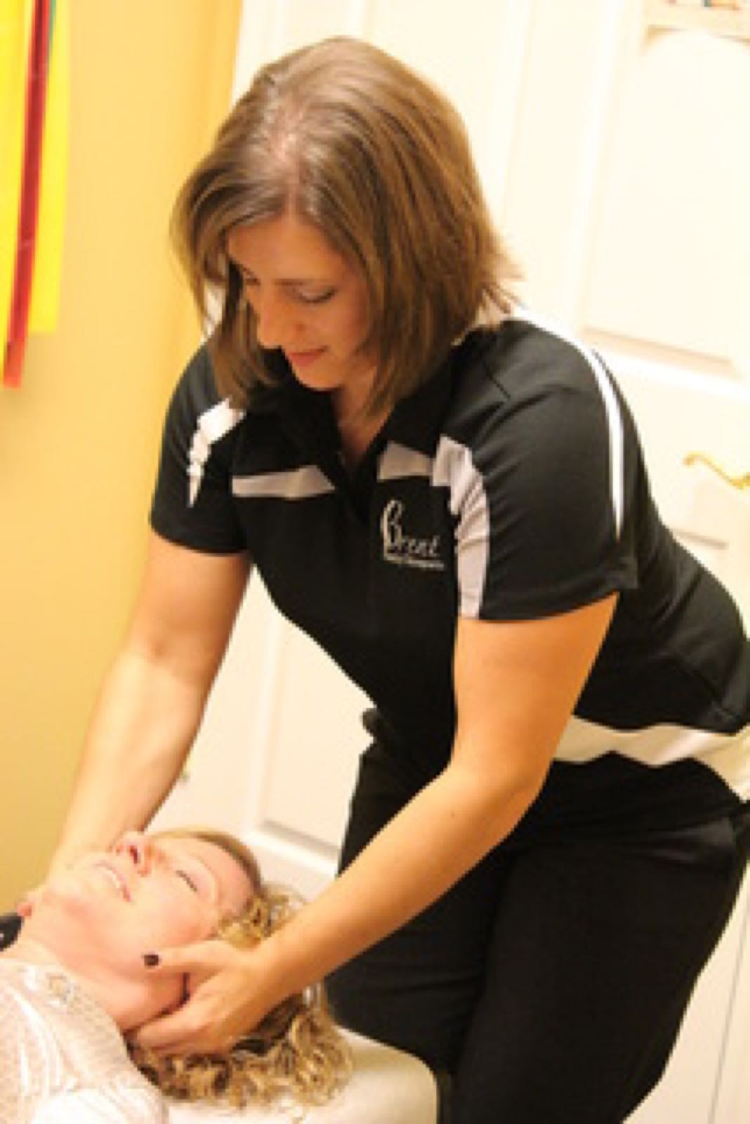 Chiropractor adjusting a patient's neck