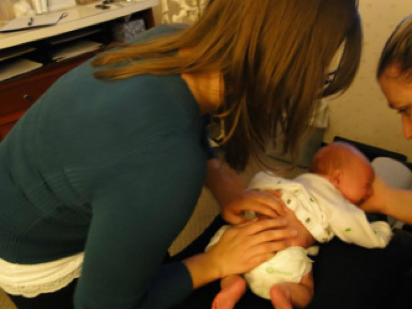 Chiropractor caring for an infant