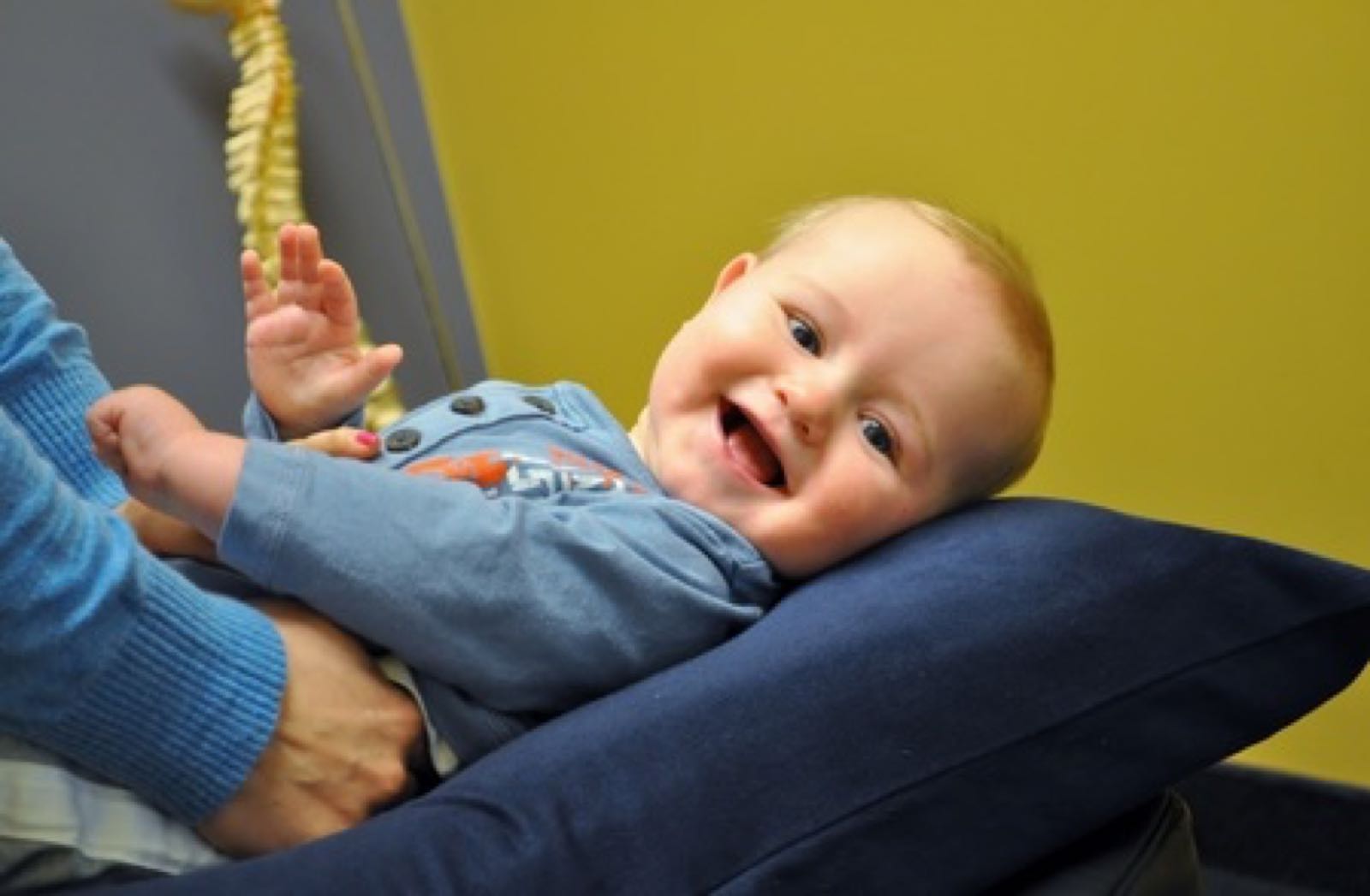 Smiling baby on a treatment table